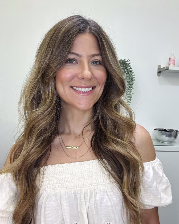 This image provided by Andrea Pezzillo shows Pezzillo, a hair stylist and men's groomer, on Aug. 1, 2023, in Los Angeles. She is among hundreds of ancillary workers in the entertainment industry impacted by the Hollywood strikes. 