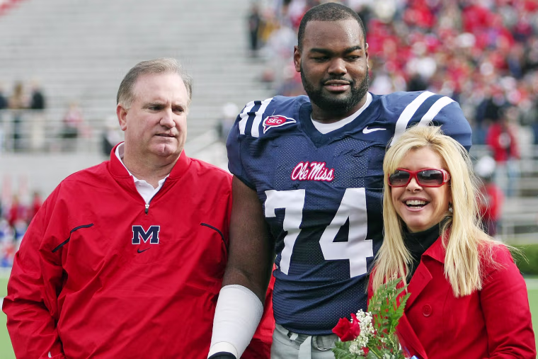 Michael Oher with Sean and Leigh Anne Tuohy prior to an Ole Miss game in 2008.