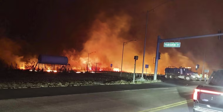 Fire and smoke fills the sky near the intersection at Hokiokio Place and Lahaina Bypass in Maui, Hawaii, on Aug. 8, 2023.