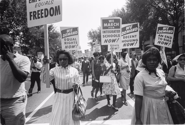 People carrying signs for equal rights, integrated schools, decent housing, and an end to bias during the March on Washington on Aug. 28, 1963.