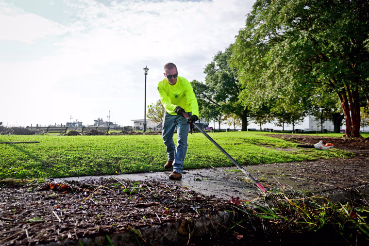 Kenny Wiggins works to clean city sidewalks around Waterfront Park in Charleston, S.C. following Tropical Storm Idalia on Aug. 31, 2023. 