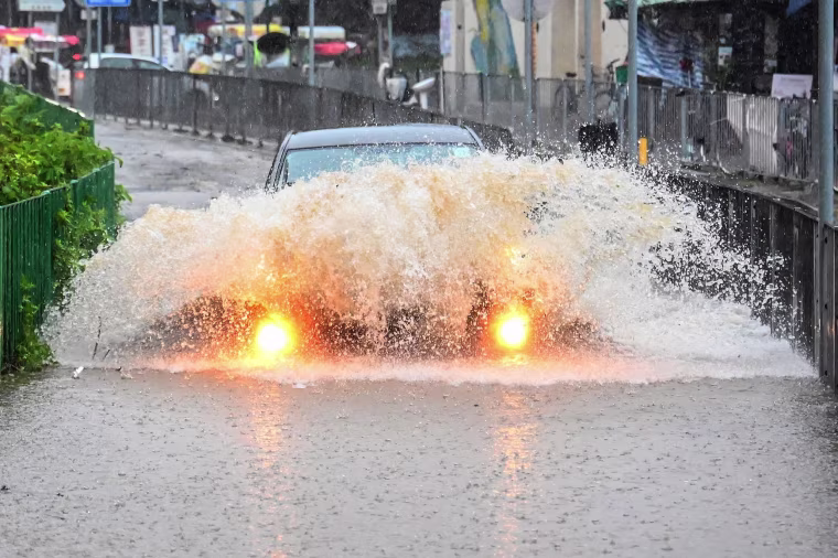Record rainfall in Hong Kong caused widespread flooding in the early hours on September 8, disrupting road and rail traffic just days after the city dodged major damage from a super typhoon.