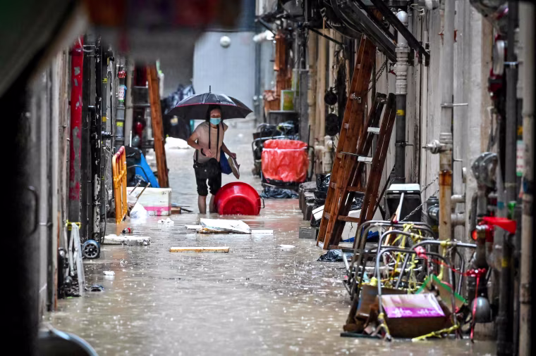 Record rainfall in Hong Kong caused widespread flooding in the early hours on September 8, disrupting road and rail traffic just days after the city dodged major damage from a super typhoon.