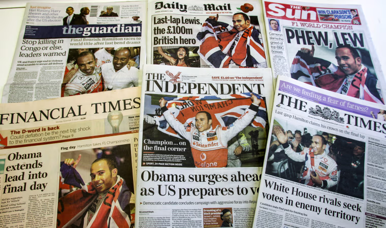 A selection of the front pages of Britian's national papers in London, on Nov. 3, 2008, showing the new Formula One Champion Lewis Hamilton celebrating in Sao Paulo, Brazil.