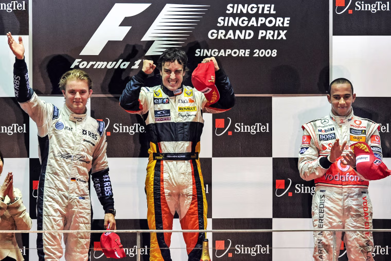 Spanish driver Fernando Alonso of Renault celebrates with third-placed British driver Lewis Hamilton of McLaren and second-placed Germany's Nico Rosberg of Williams on the podium following Alonso's victory in the Singapore Grand Prix Formula One final on Sept. 28, 2008.