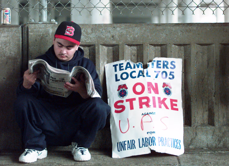 Steve Romero on strike outside a UPS facility in Chicago in 1997.