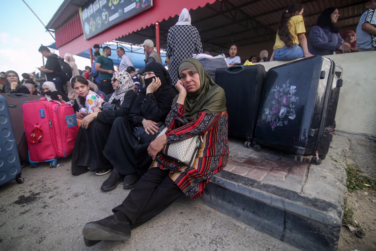 Palestinians waiting to cross the Rafah Border Gate