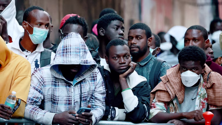 Migrants outside the Roosevelt Hotel in New York City on Aug. 2, 2023.