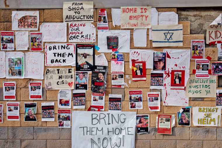 Posters, pictures and signs calling for the return of the hostages near the Ministry of Defense in Tel Aviv. 