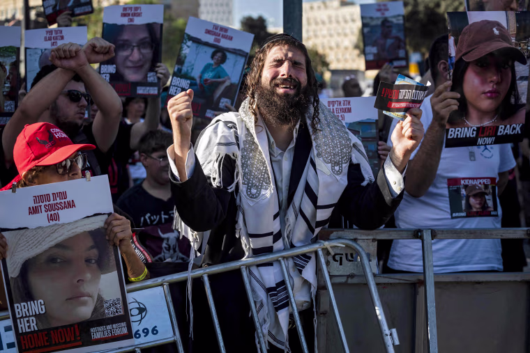 Friends and relatives of Israeli hostages abducted by Hamas demonstrate outside the Knesset in Jerusalem.