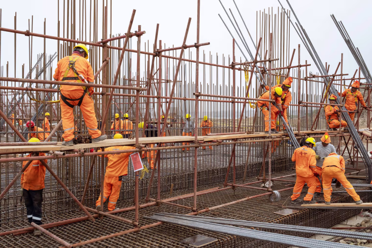 Several hundred workers brought in from China are building the port with Peruvians.