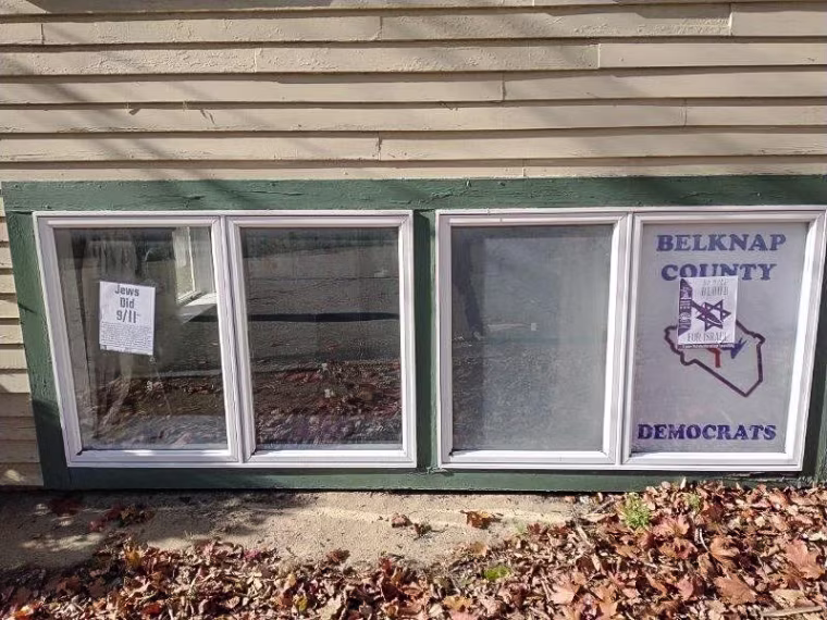Posters are found on the outside of the Belknap County Democratic Party office showing a star of David with a knife through it and another accusing Jews of being behind the 9/11 terrorist attacks.