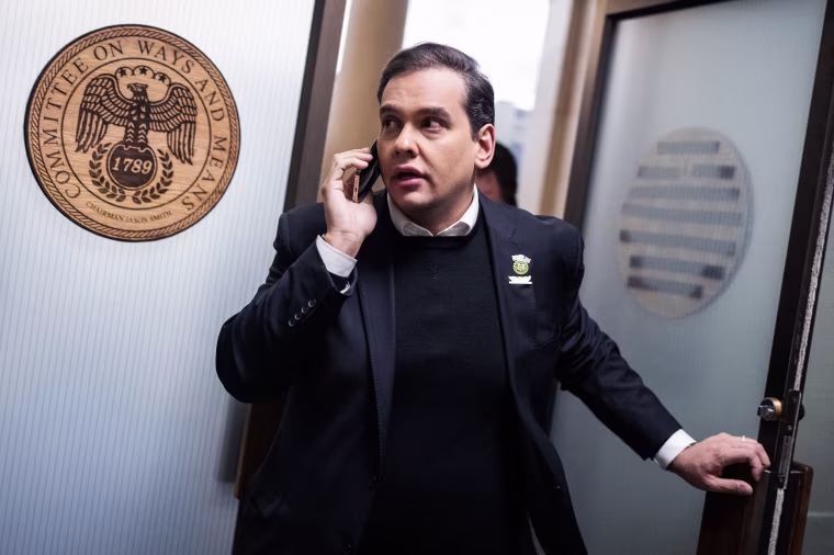 Rep. George Santos leaves a meeting in Longworth Building