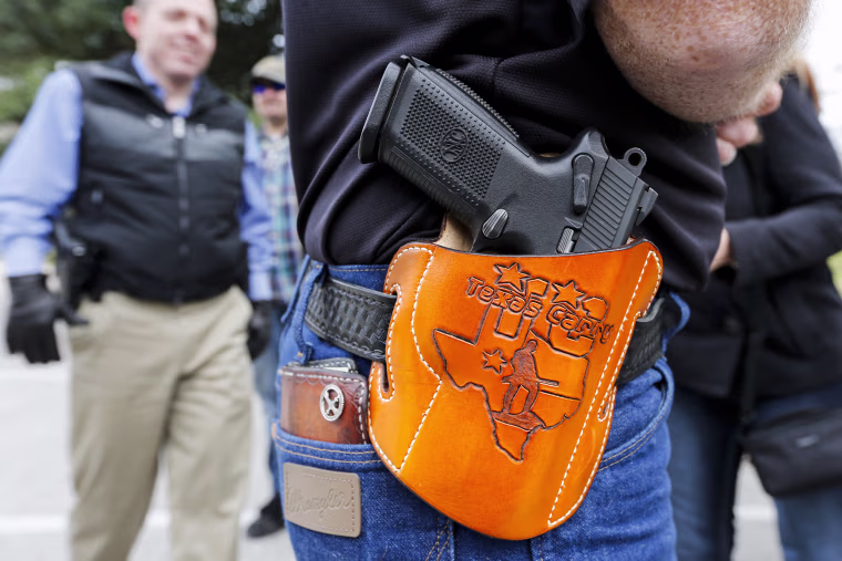 People wear their guns at an open carry rally in Texas.