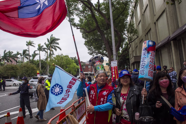A KMT supporter outside the Central Elections Commission in Taipei on Friday.
