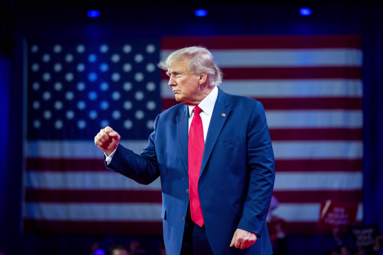 Donald Trump pumps his fist as he departs after speaking at the Conservative Political Action Conference in March 2023.