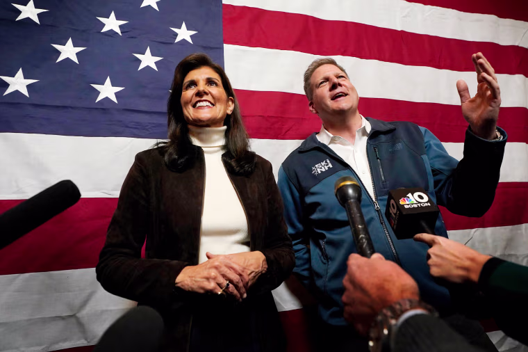 Nikki Haley and Gov. Chris Sununu speaks to reporters