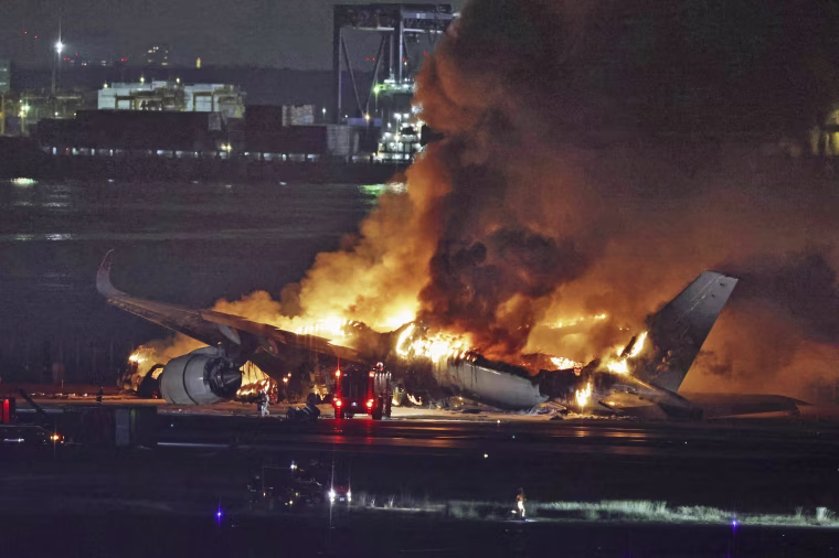 A Japan Airlines plane burns on the runway of Haneda airport on Tuesday, Jan. 2, 2024 in Tokyo.