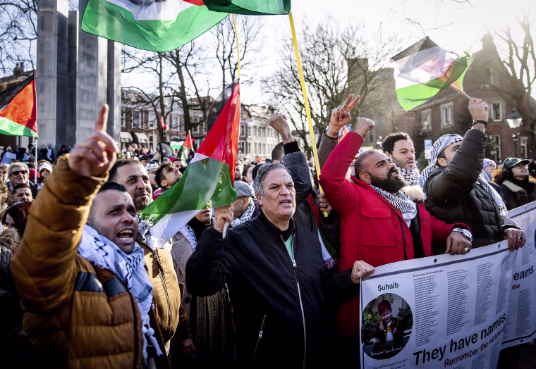 Image: Protesters take part in a demonstration in solidarity with the Palestinian population, as the International Court of Justice