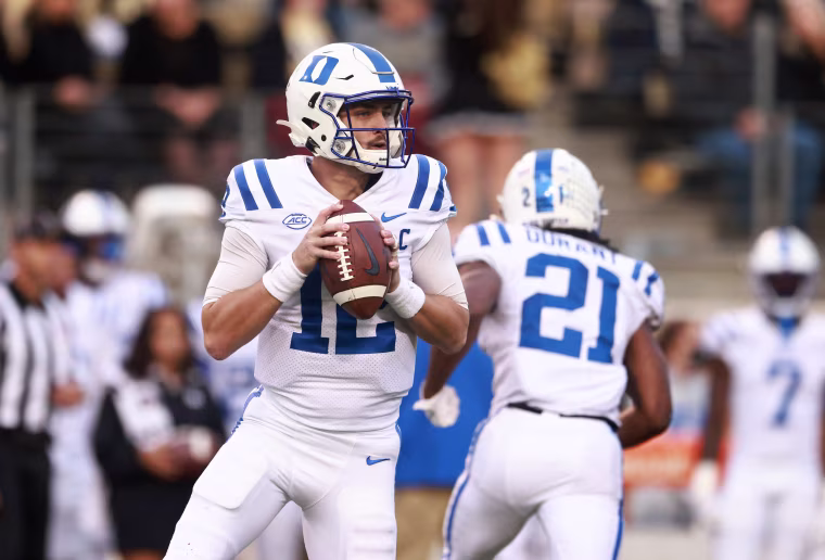 Gunnar Holmberg of the Duke Blue Devils looks to pass in 2021.