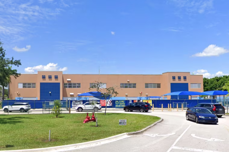 Cars outside Manatee Bay Elementary School in Weston, Fla.