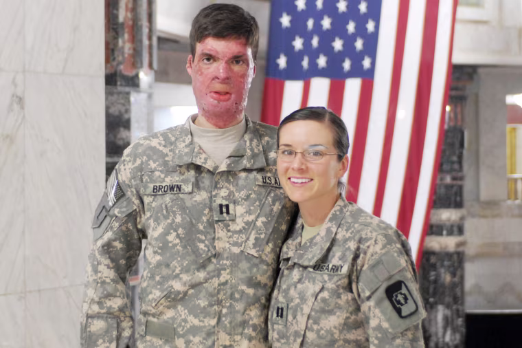 Capt. Sam Brown with his wife, Capt. Amy Brown, inside Camp Victory's Al Faw Palace.