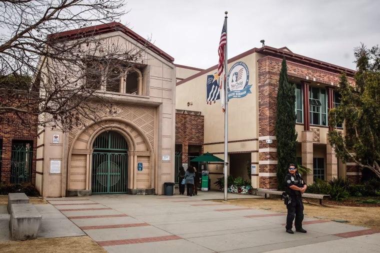 Security guards stand outside at Beverly Vista Middle School on Feb. 26, 2024 in Beverly Hills, Calif.