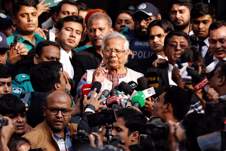 Bangladeshi Nobel peace laureate Professor Muhammad Yunus gestures in front of the court after being sentenced for six months of imprisonment, in Dhaka