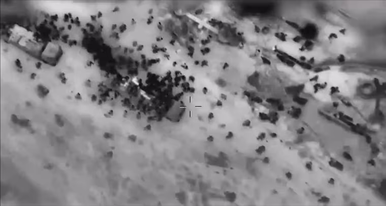 In another segment from IDF video released Feb. 29, people rapidly move away from what look like aid trucks and onto lower ground on the beach.