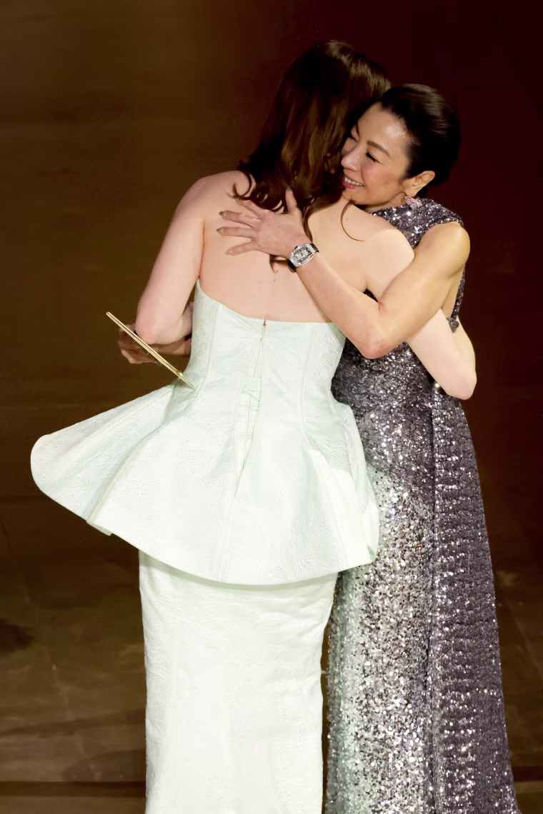 Emma Stone hugs Michelle Yeoh