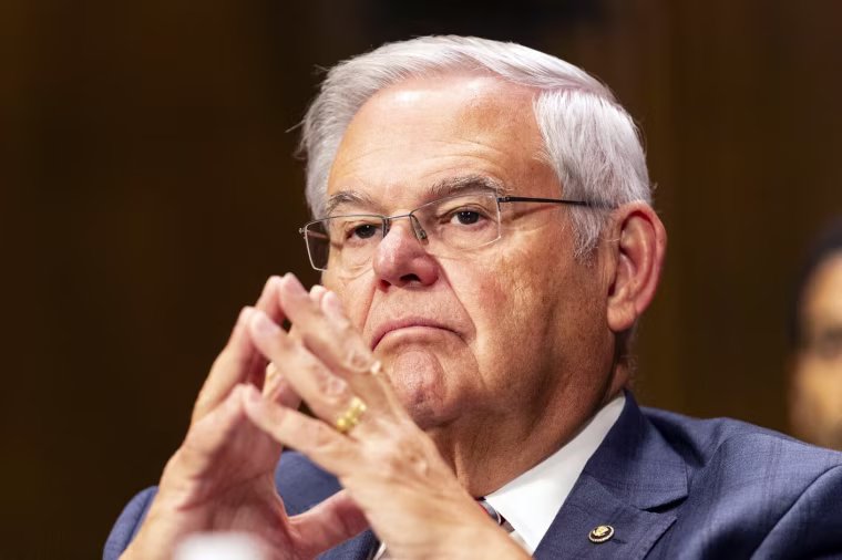 Bob Menendez listens during a hearing.