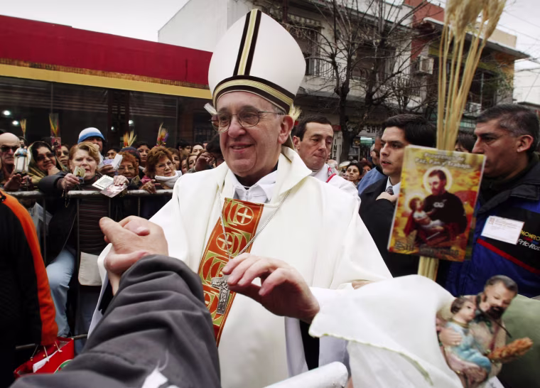 Image: File photo of Archbishop of Buenos Aires Cardinal Jorge Mario Bergoglio greeting worshippers, in the Buenos Aires neighbourhood of Liniers