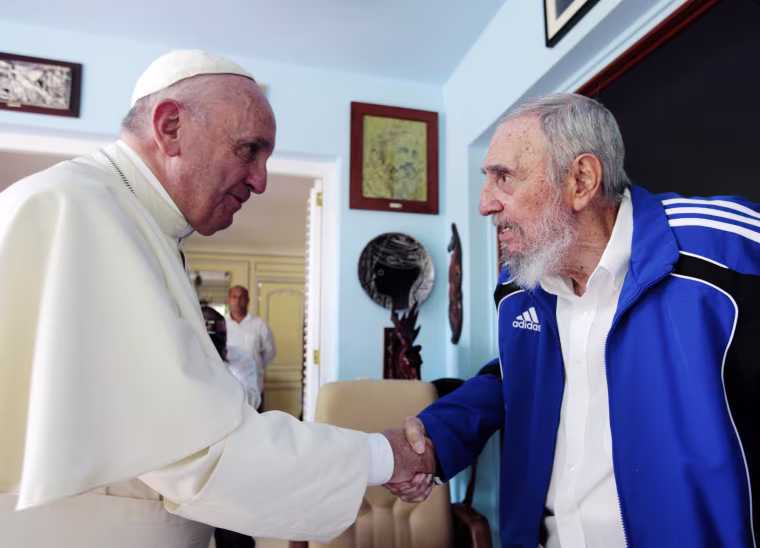 Pope Francis and Cuba's Fidel Castro shakes hands in Havana on Sept. 20, 2015. The Vatican described the 40-minute meeting at Castro's residence as informal and familial, with an exchange of books. 