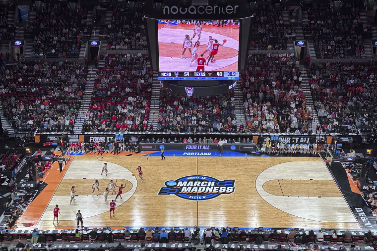 Texas players defend as North Carolina State players pass the ball during the second half of an Elite Eight college basketball game in the women's NCAA Tournament in Portland, Ore., on Sunday, March 31, 2024. North Carolina State won 76-66.