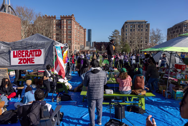 Students from MIT, Harvard University and others rally at a protest encampment on the MIT campus in Cambridge, Mass.