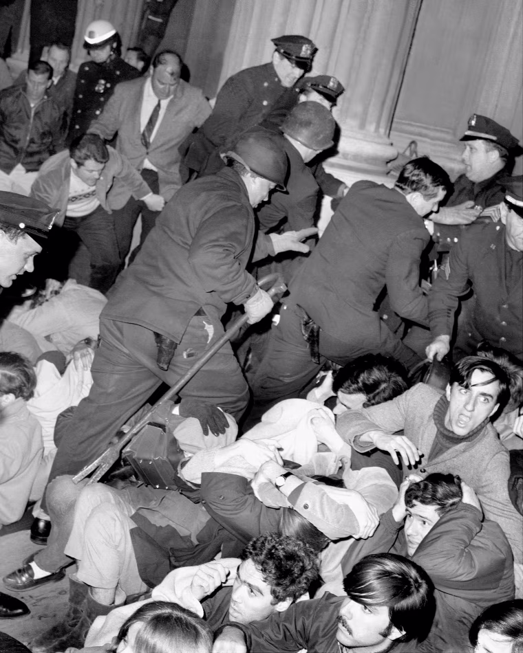 Police breaking through student demonstration at Low Library