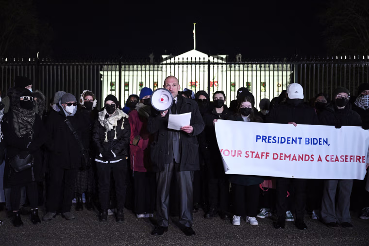 U.S. officials who resigned over response to war in Gaza say Biden's arm threat a 'step in the right direction'.