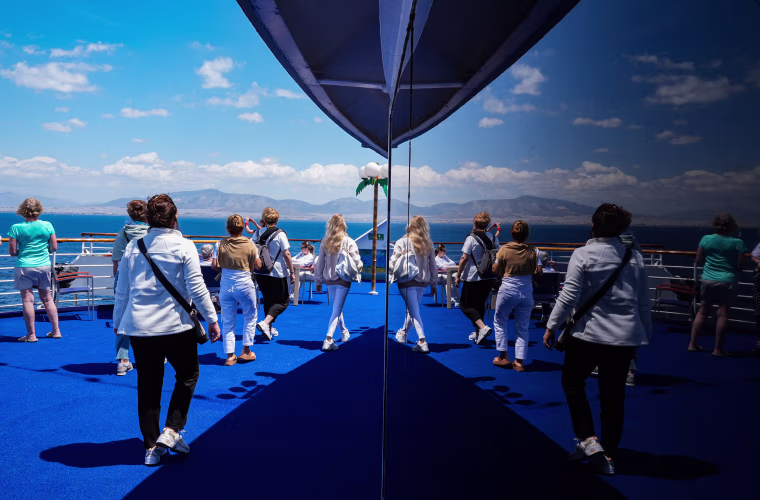 Travelers on the deck of a cruise ship