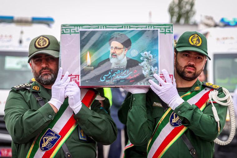 Guards carrying the coffin of late president Ebrahim Raisi 
