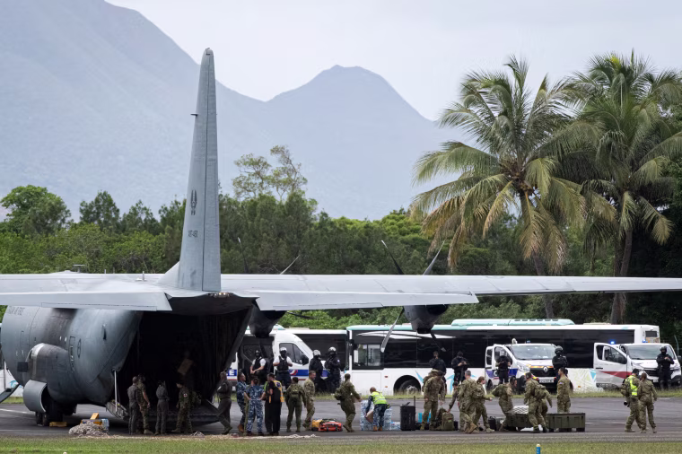 An aircraft being prepared to evacuate people.