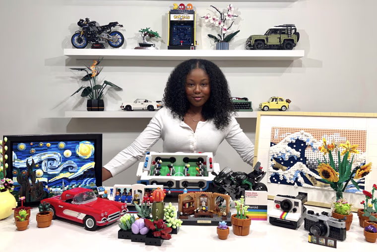 Alyssa Evans, 23, in front of her massive Lego set collection.