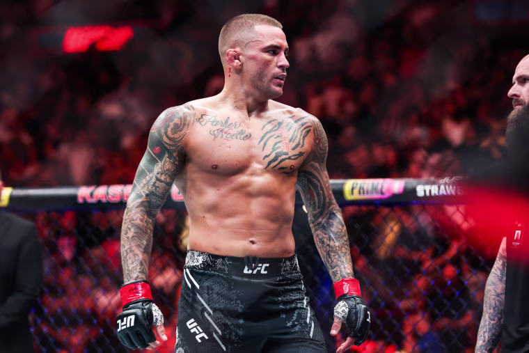 Dustin Poirier stands inside of the fighting ring