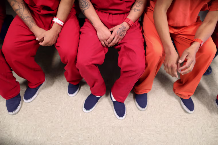 ICE detainees siting together at the Adelanto immigration detention center in Adelanto, Calif.