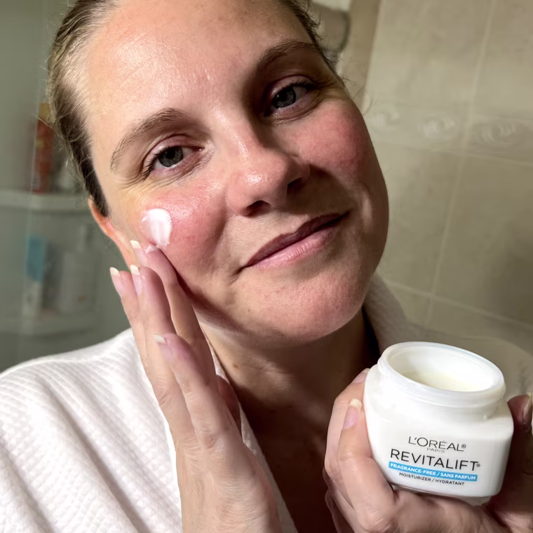 Applying L'Oreal Paris Revitalift Anti-Wrinkle Firming Day Cream.