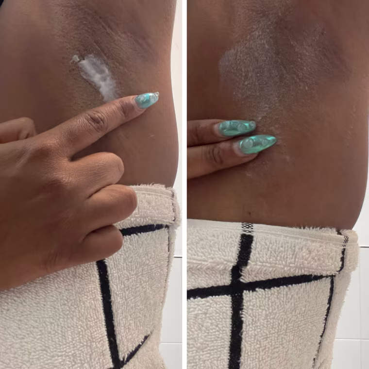 Morris applying a single swipe of Lume’s body deodorant to her underarm using her finger.