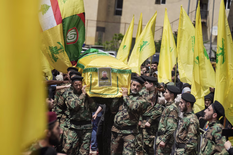 Hezbollah fired a massive barrage of rockets into northern Israel on Wednesday to avenge the killing of the top commander in the Lebanese militant group as the fate of an internationally-backed plan for a cease-fire in Gaza hung in the balance. 