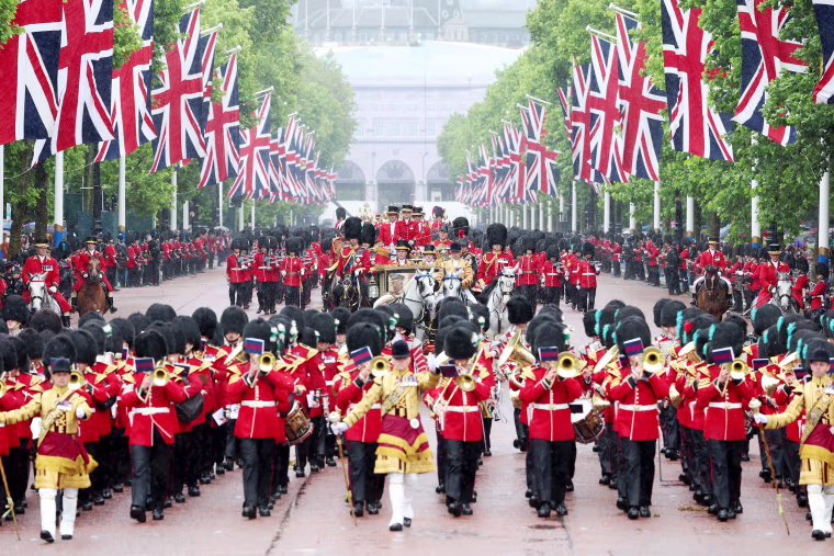 Trooping the Colour is a ceremonial parade celebrating the official birthday of the British Monarch. The event features over 1,400 soldiers and officers, accompanied by 200 horses. More than 400 musicians from ten different bands and Corps of Drums march and perform in perfect harmony.