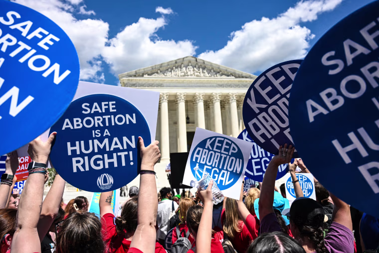 Reproductive rights activists demonstrate in front of the Supreme Court