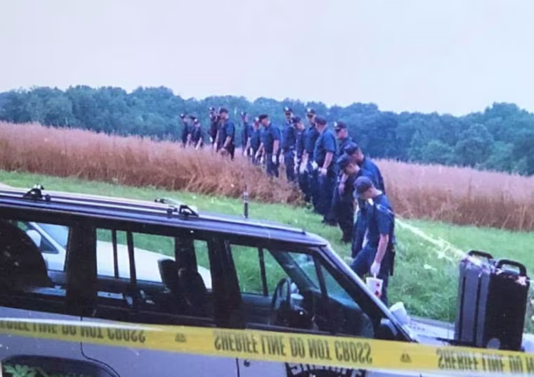 Searching the area where the body was found.