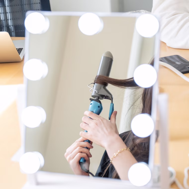 The Shop TODAY team testing curling irons while using the Hollywood Vanity Mirror